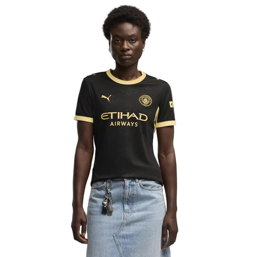 Camisola Alternativa Feminina Preta e Dourada Manchester City - 26/27